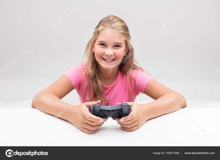 blonde girl in pink is a videogame player